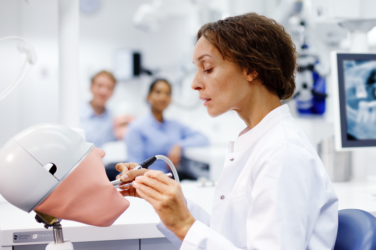 Image of dentist practicing academy